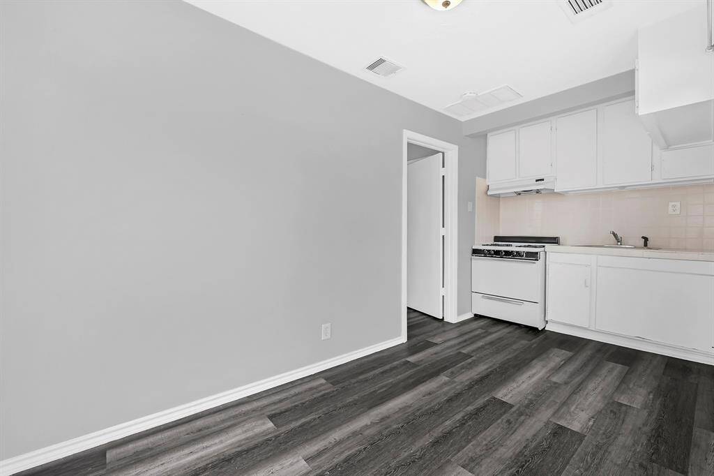 There’s an additional apartment in the back, which includes a one-bedroom, kitchen, living space, and bathroom.