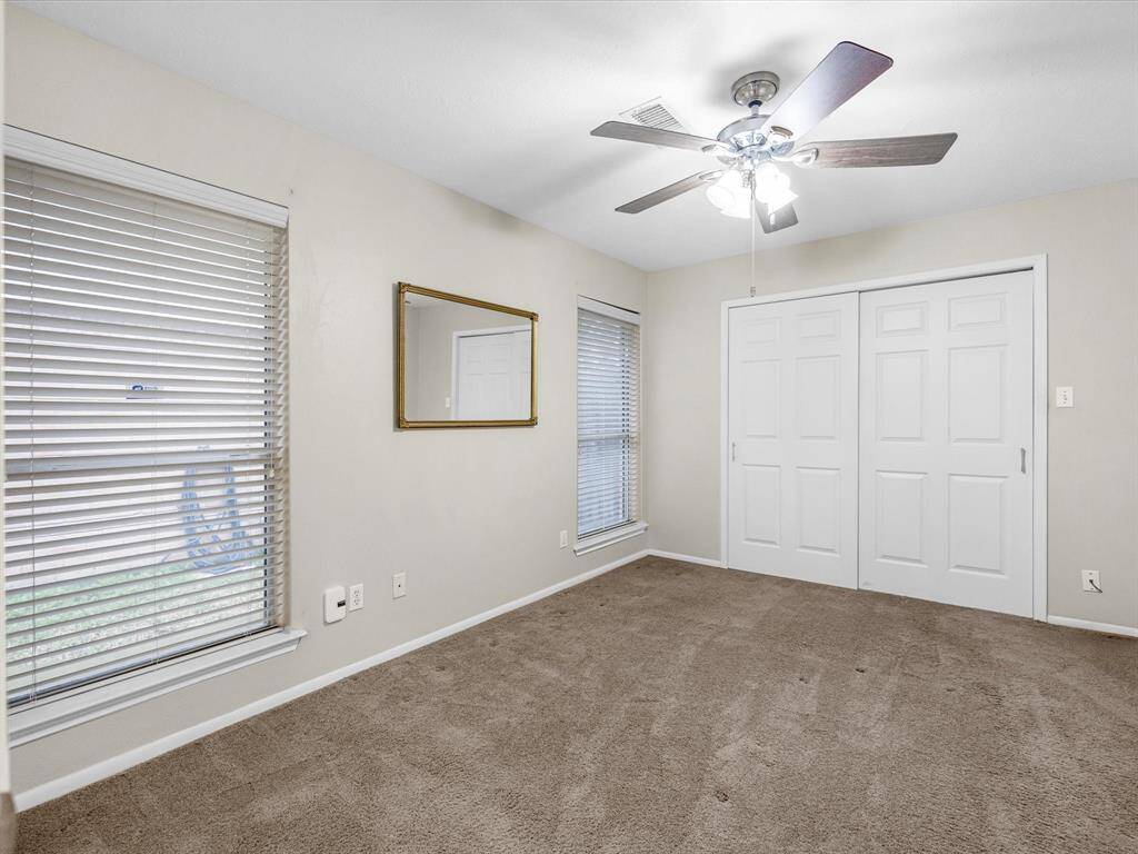 Primary bedroom with walk-in closet and en-suite bath