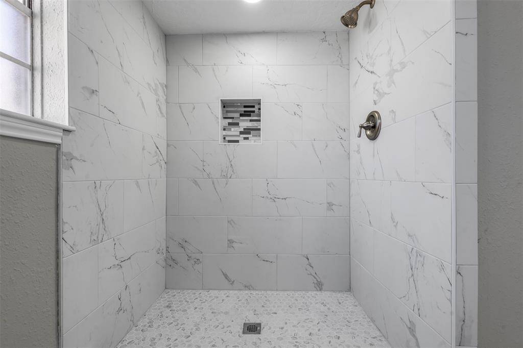 Beautiful new floor to ceiling tiled shower.