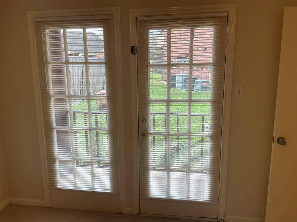 Unit B Primary bedroom door to small patio