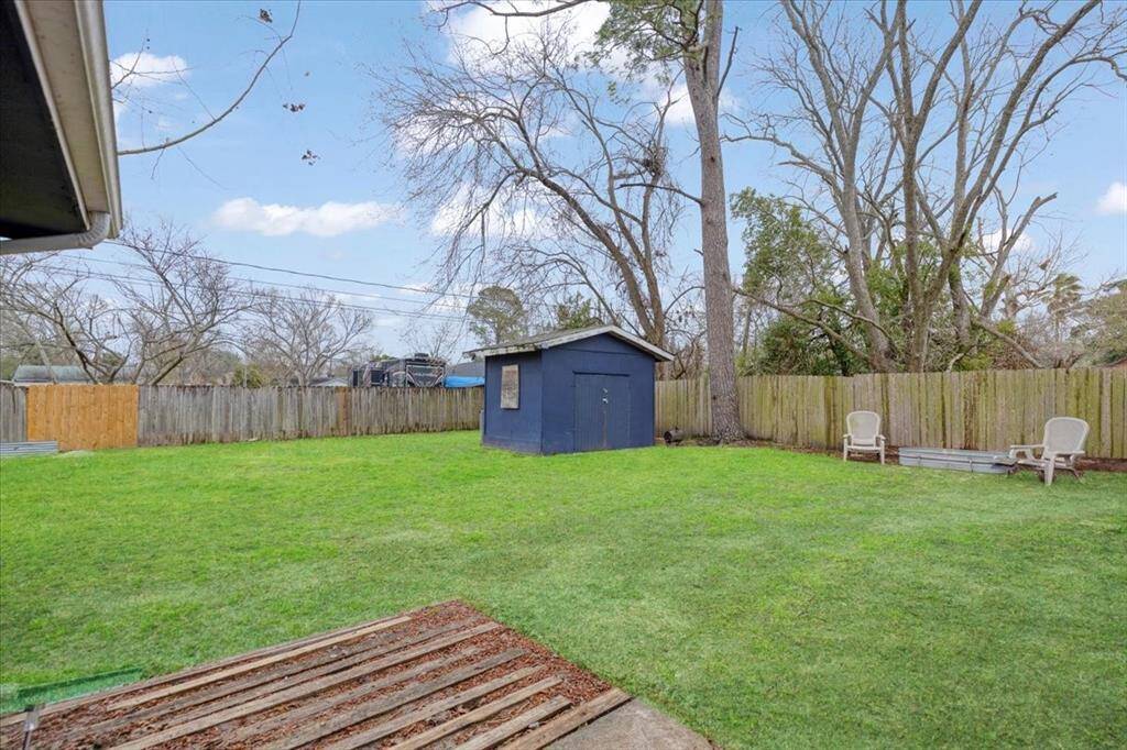 Backyard with storage shed.
