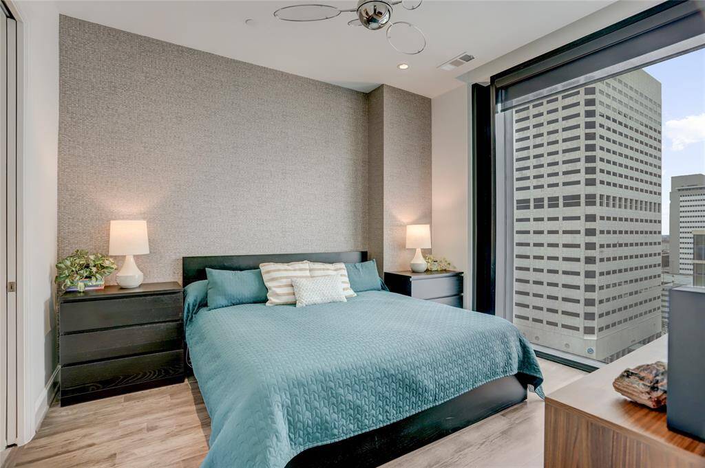 The primary suite is designed for both comfort and style, offering plenty of space for a king-size bed and additional furniture. A spacious walk-in closet provides excellent storage, while the ensuite bath adds convenience. Blackout shades create the perfect setting for a restful night’s sleep.
