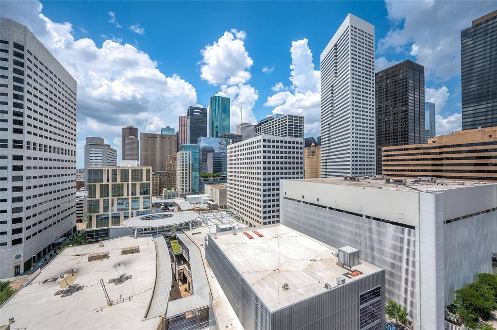 From the balcony, the city stretches out before you. By day, natural light floods the streets below.As the sun sets, the buildings glow with golden reflections, transitioning into a sea of twinkling lights against the night sky.