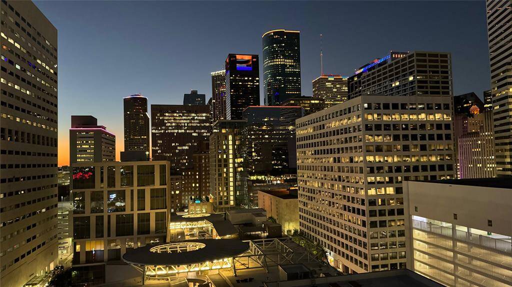The city comes alive under the night sky, and there's no better view than from this balcony. Twinkling lights stretch for miles, creating a breathtaking backdrop for a quiet evening. Whether it's enjoying a beverage of your choice, winding down after a long day, or simply taking in the beauty of Downtown Houston, this view never gets old!