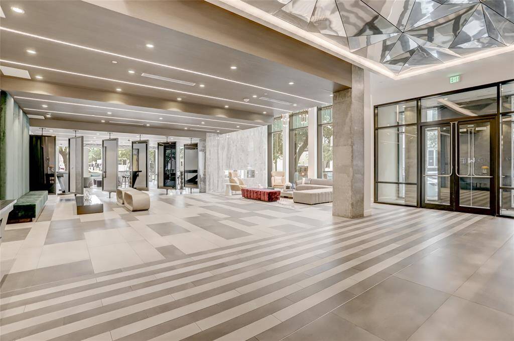 Beyond the entrance, the lobby extends into thoughtfully designed spaces that balance style and function.