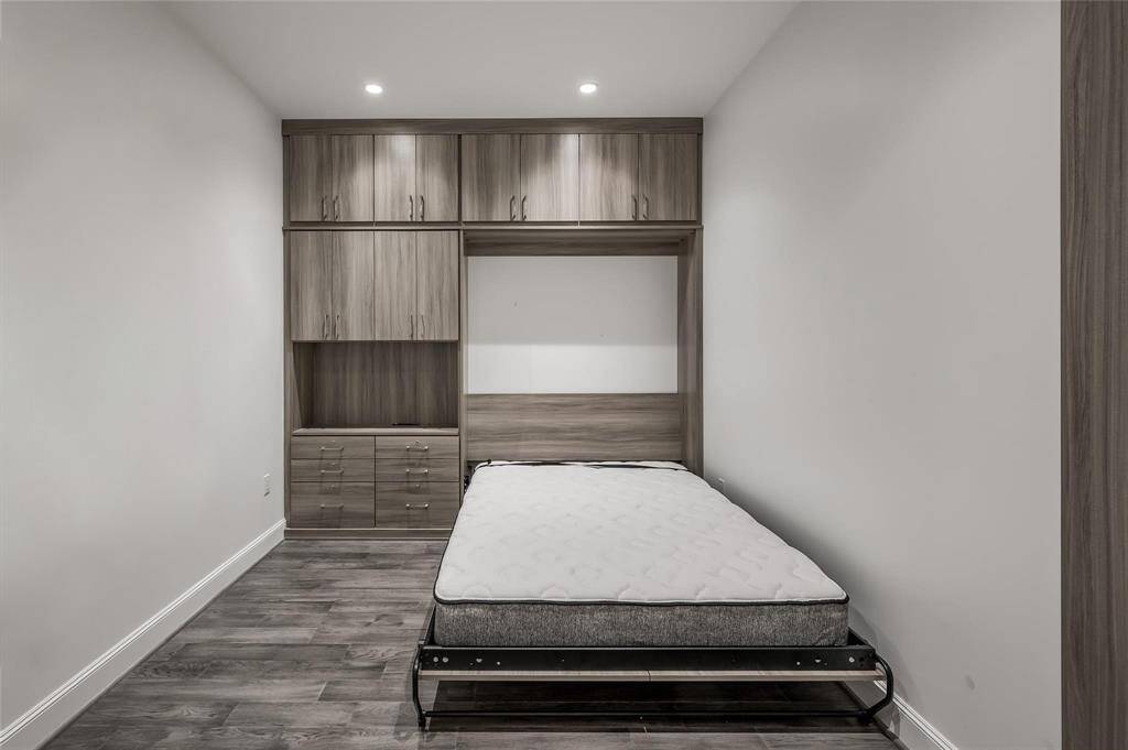 A detailed view of the custom Spaceman Murphy bed, integrated to maximize space and versatility in this flex room.
