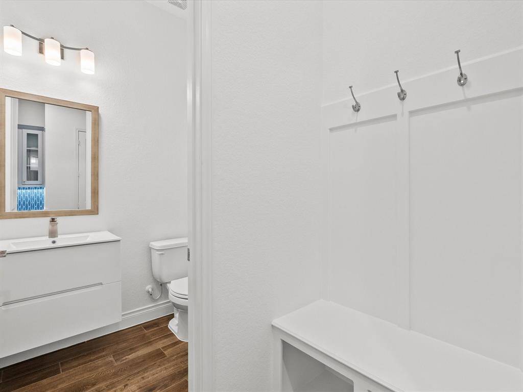 Half Bath & Entrance Nook Off Attached Garage Entrance Into House.