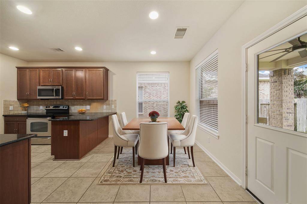 The eat-in kitchen with lots of natural light.