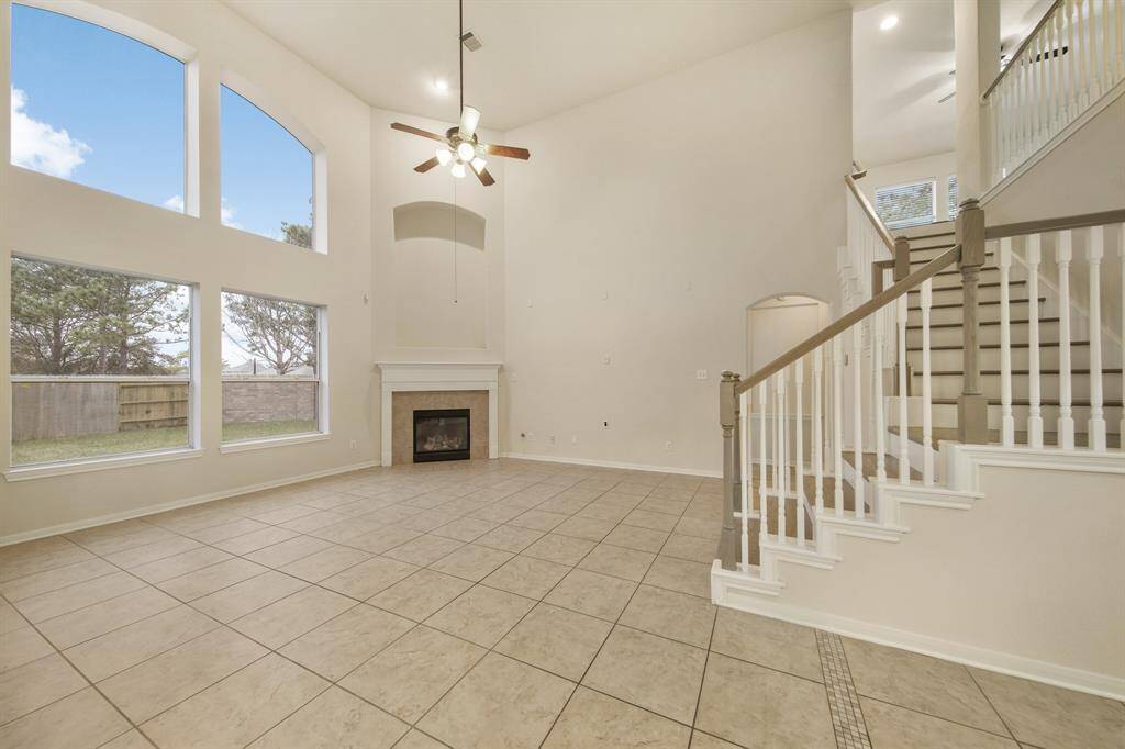 The view as you walk out of the kitchen into the open concept living space.