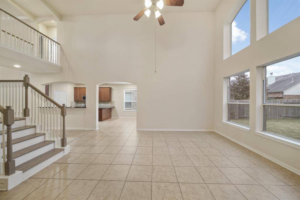 Living room view as you walk out of the primary bedroom.