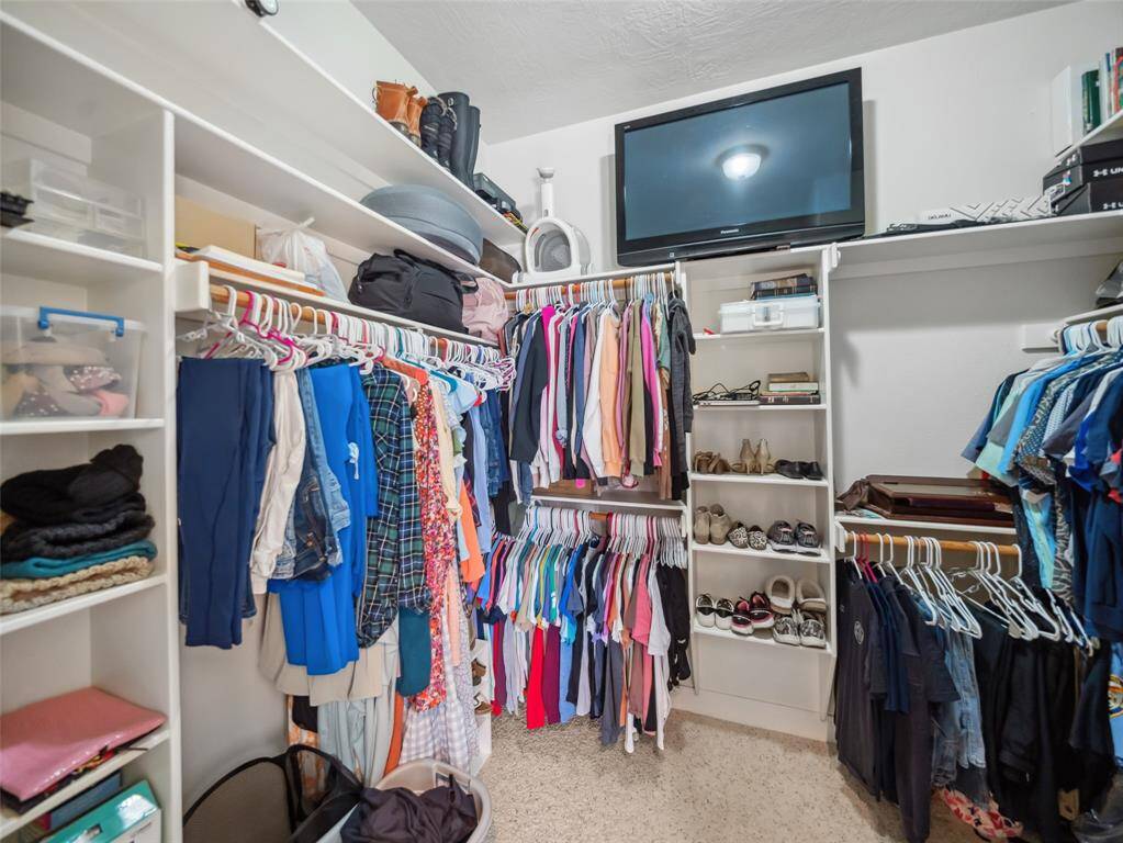 Large primary closet with built ins.