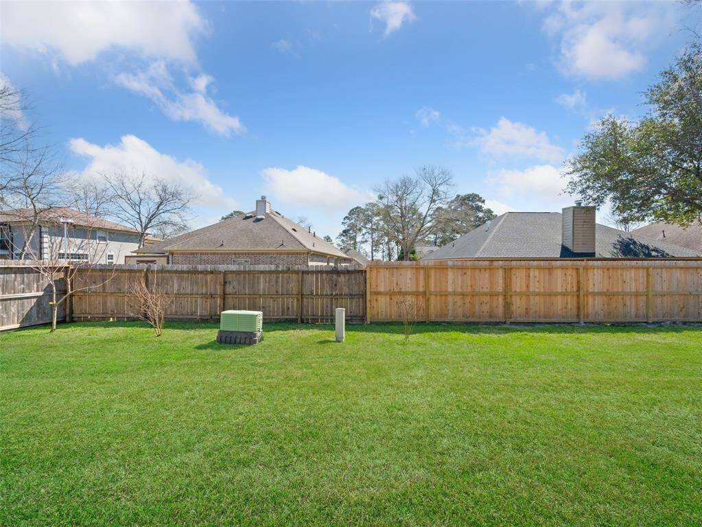 Large fenced back yard is ready for outdoor games or add your own pool!