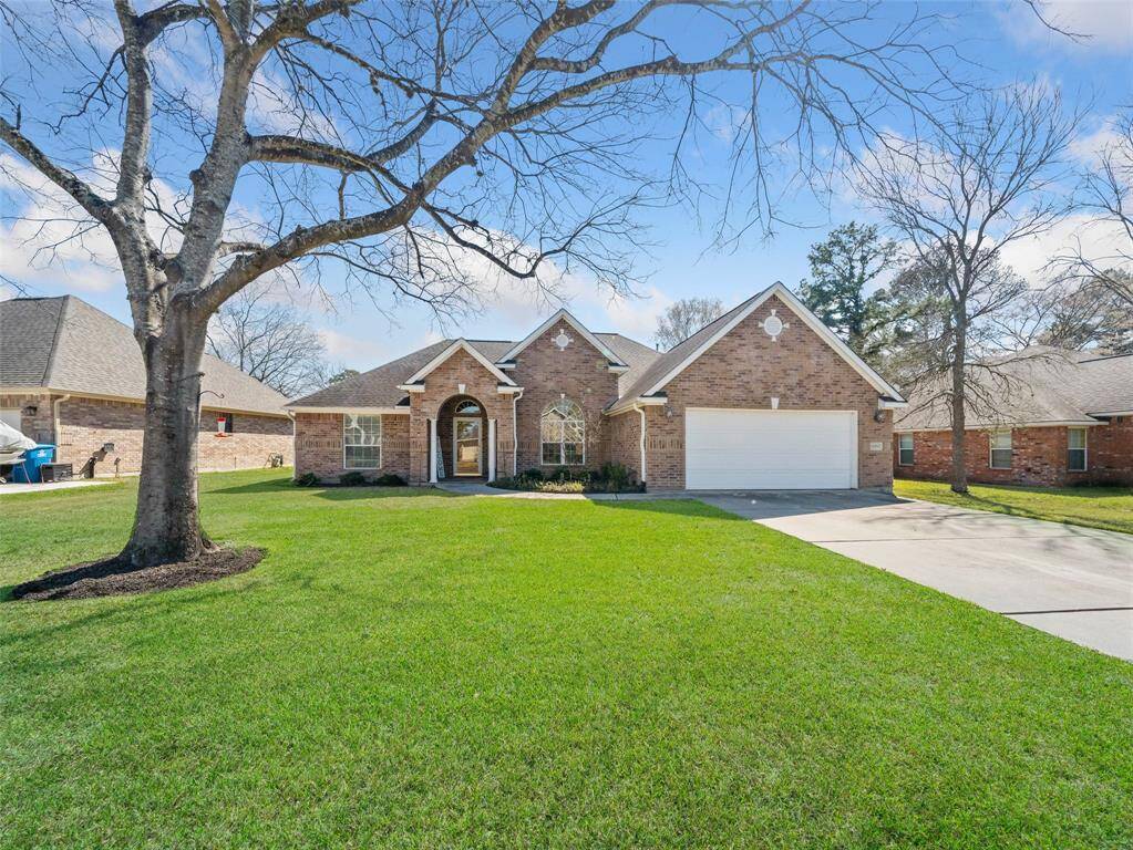 Large front yard and double driveway.