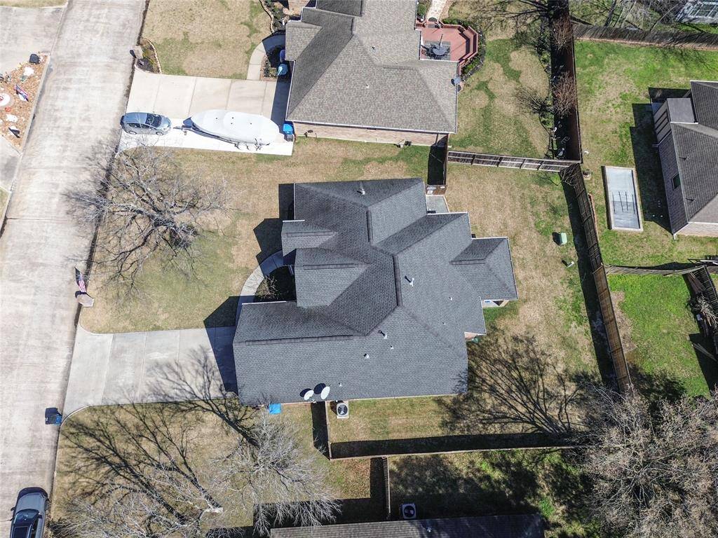 Aerial view of the home shows the footprint of the home and yard space.