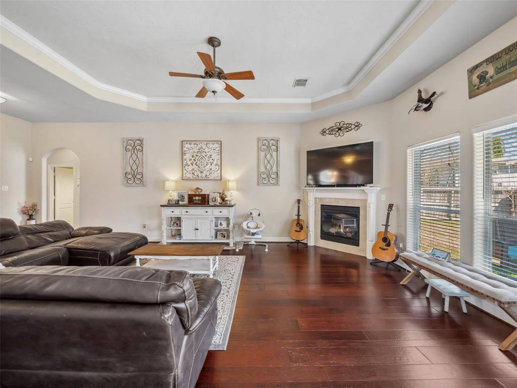 Windows overlooking the back yard add plenty of natural light. The coved ceiling trimmed in crown molding also adds a nice detail.