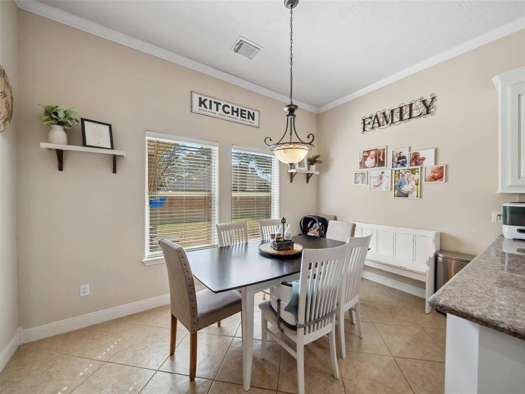 Windows overlook the back yard. Neutral finishes throughout the home.