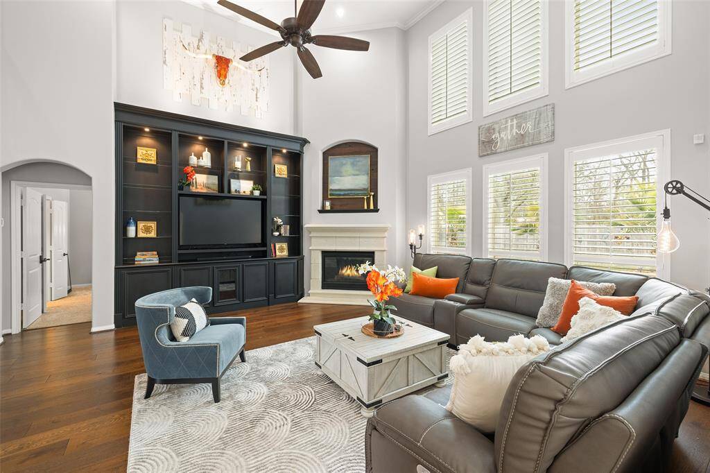 Tucked discretely behind the Den is your Primary Bedroom Suite complete with a spacious Bedroom, ensuite and oversized walk-in closet. Notice the soaring 18' ceiling and up-lighting to accentuate artwork above the custom built bookcase.