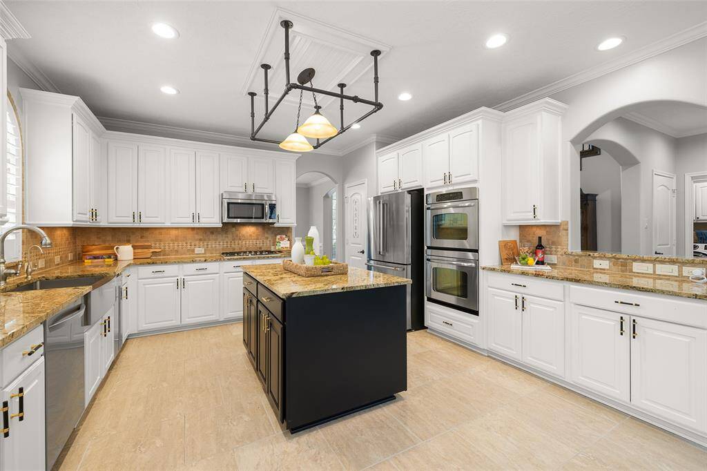 The Chef in your home will absolutely LOVE this suite of professional grade stainless steel appliances: LG brand dishwasher, Scotsman brand built-in ice maker, Viking brand 5-burner gas cooktop with continuous surface cast-iron cooking grates, a Kitchen-Aid brand microwave oven and GE brand, electric double ovens, top unit with convection cooking.