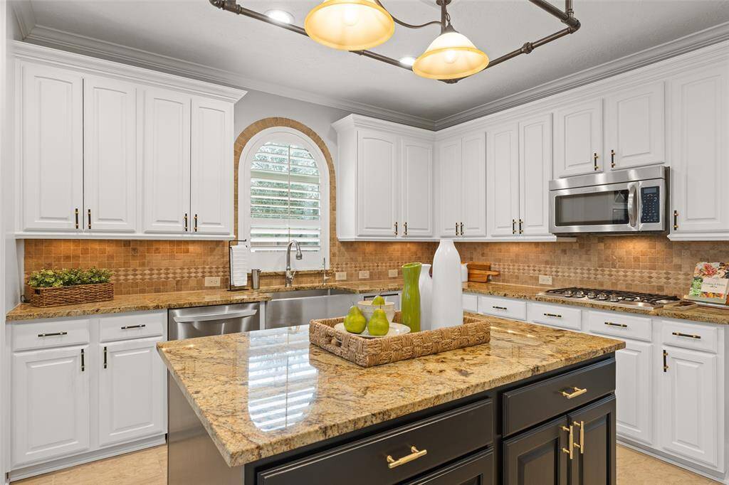 This Kitchen is both beautiful and functional with loads of perimeter storage, a center island and pantry. You have tons of granite countertop space for preparing meals. Everyone will gather around the center island which is the ideal spot for serving weeknight meals and entertaining in grand style for holiday gatherings.