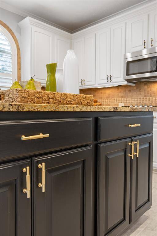 The Homeowner paid great attention to every detail of this home as seen here with the brushed gold / etched hardware on the Kitchen island.