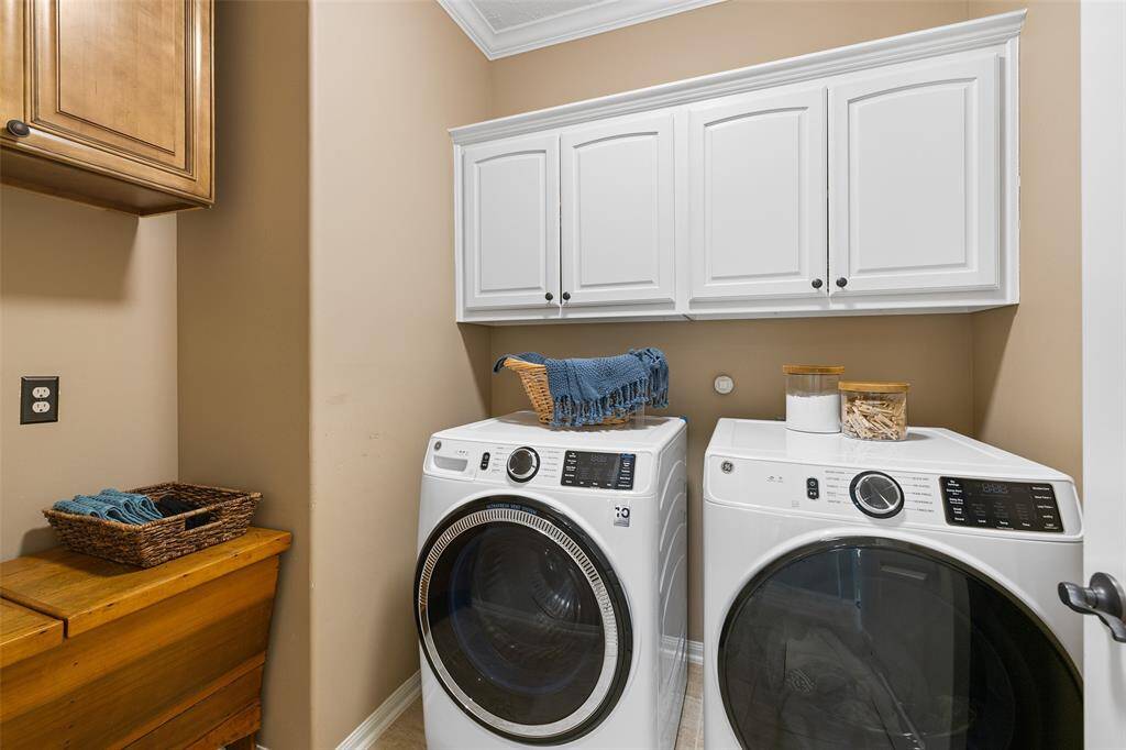 The first floor laundry room is vented, and offers easy maintenance floor tiles, cabinet storage, electric and gas dryer connections. Next to the laundry is a coat closet with extra deep storage under the stairs.