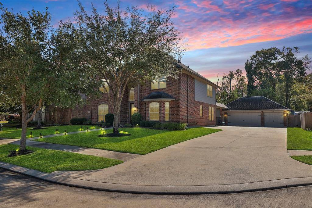 The long, double-wide driveway provides plenty of parking for family and friends, and leads to an impecably finished 3-car garage with epoxy floors and overheat storage.