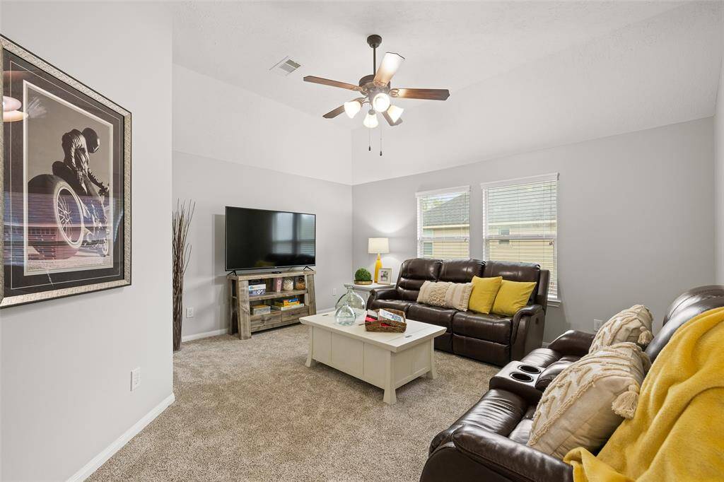 Tucked upstairs is a comfortable carpeted space you can use as a Game Room, Media Room, Home Gym or Kids Playroom.