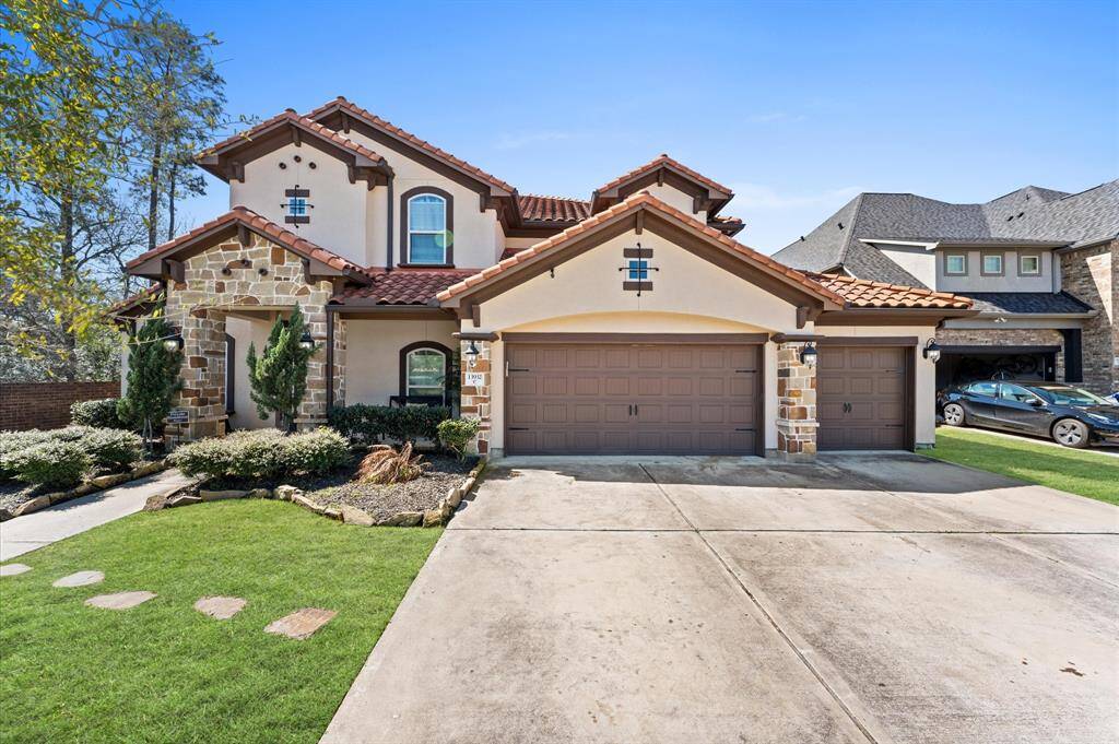 This home features a stunning elevation with a stone and stucco exterior that harmonizes beautifully with the landscape.