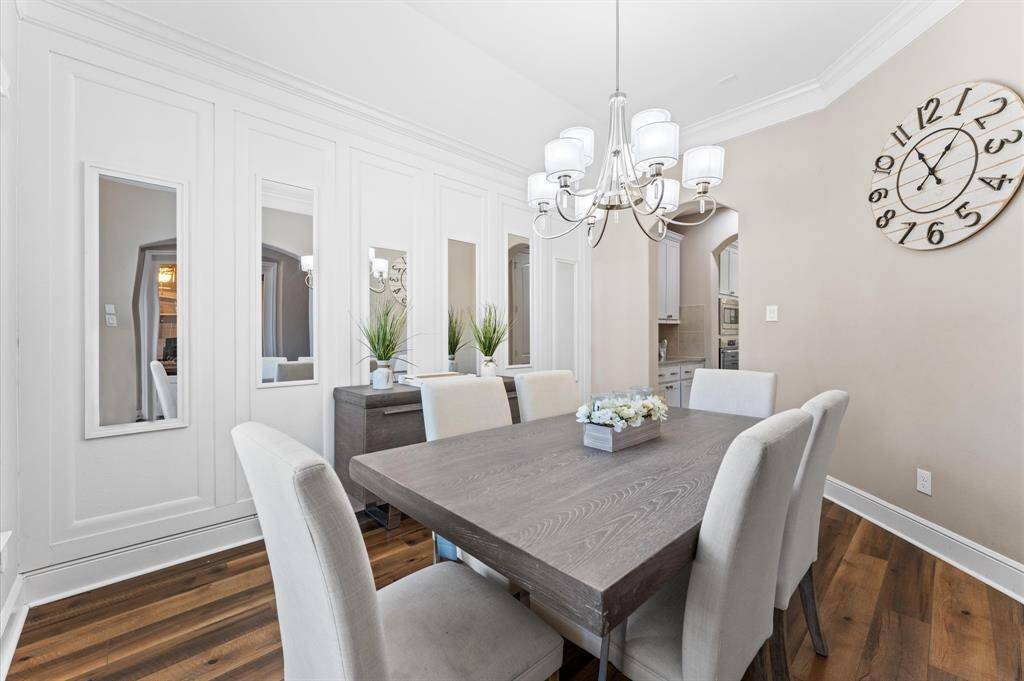 To left of entry you will see a formal dining room complete with crown molding which adds an elegant touch. The perfect setting for memorable dinners and special occasions.