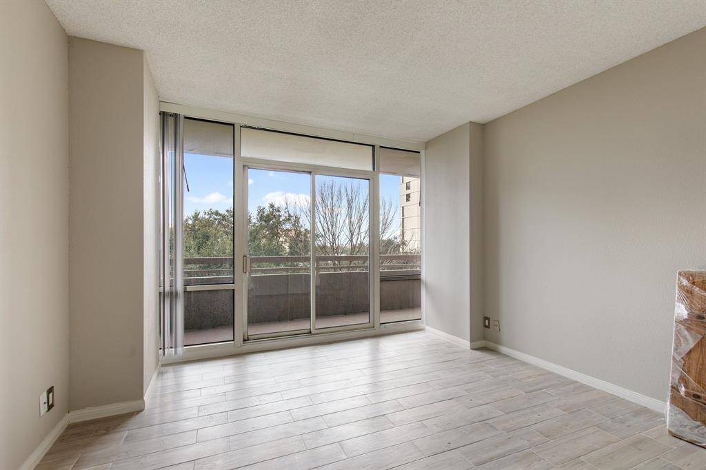 Second bedroom with balcony access.