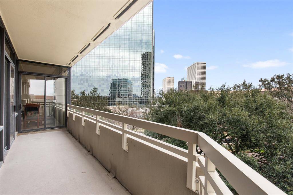 Balcony with treetop views with Greenway Plaza beyond.