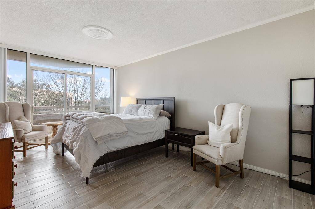 Primary bedroom with balcony access.