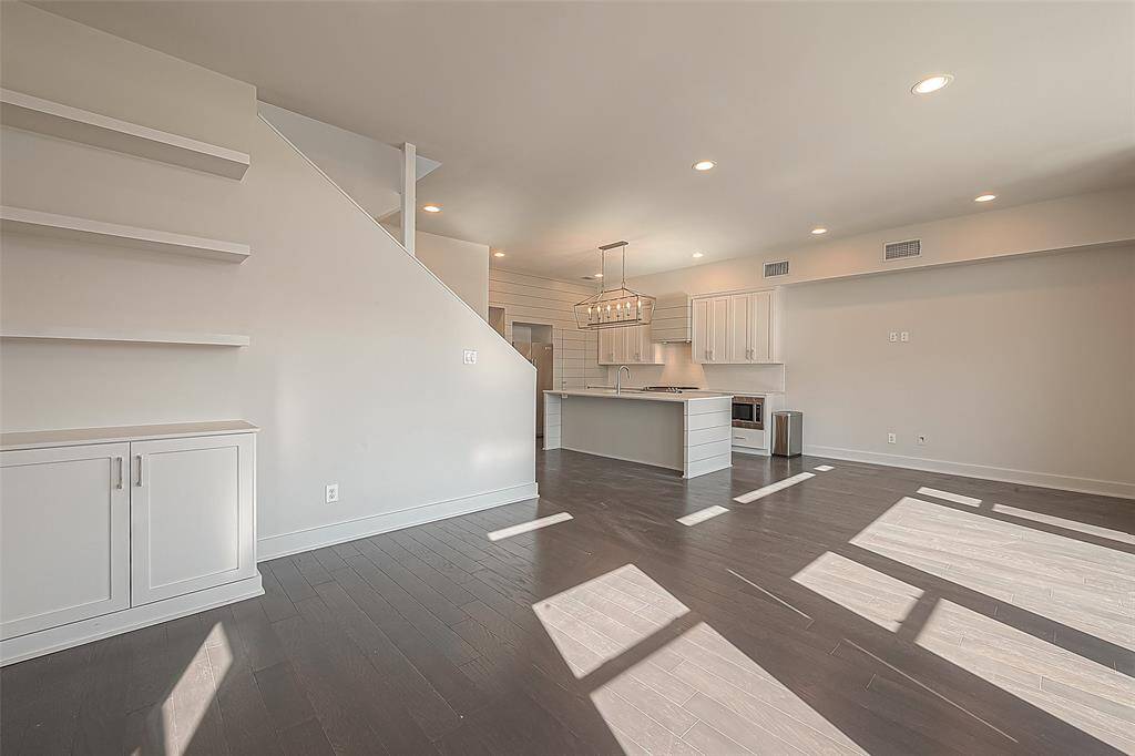 Gorgeous wood floors, 9 ft ceilings filled with light from all around