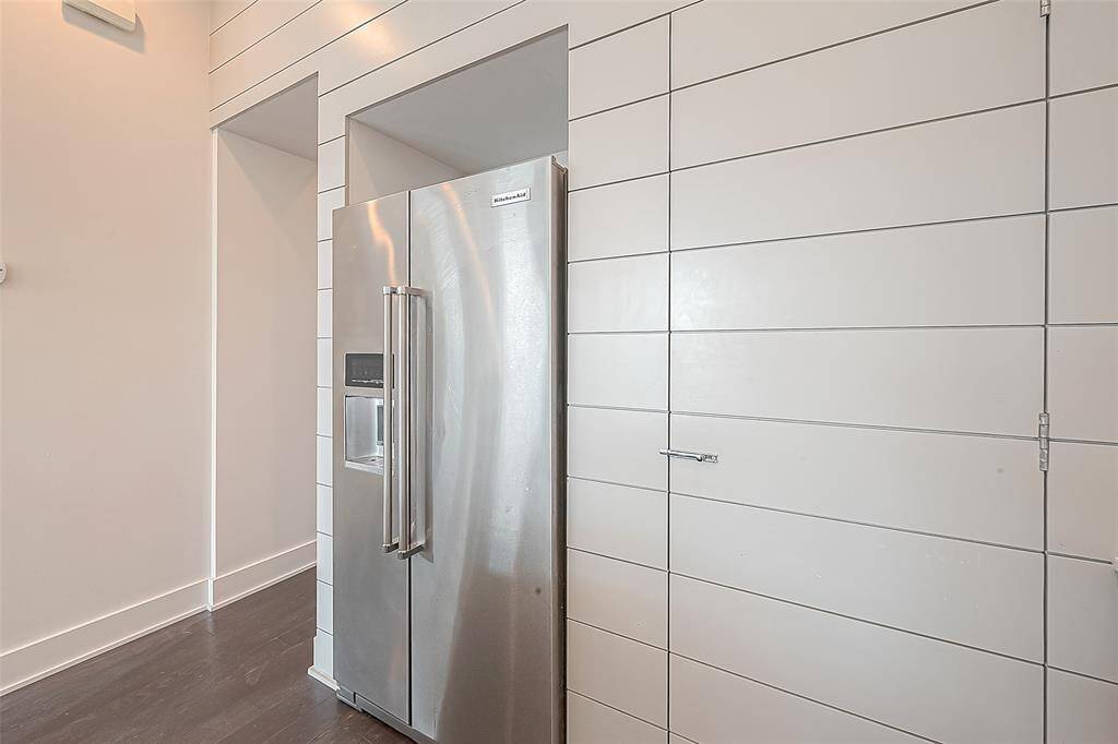 Pantry door to right of fridge