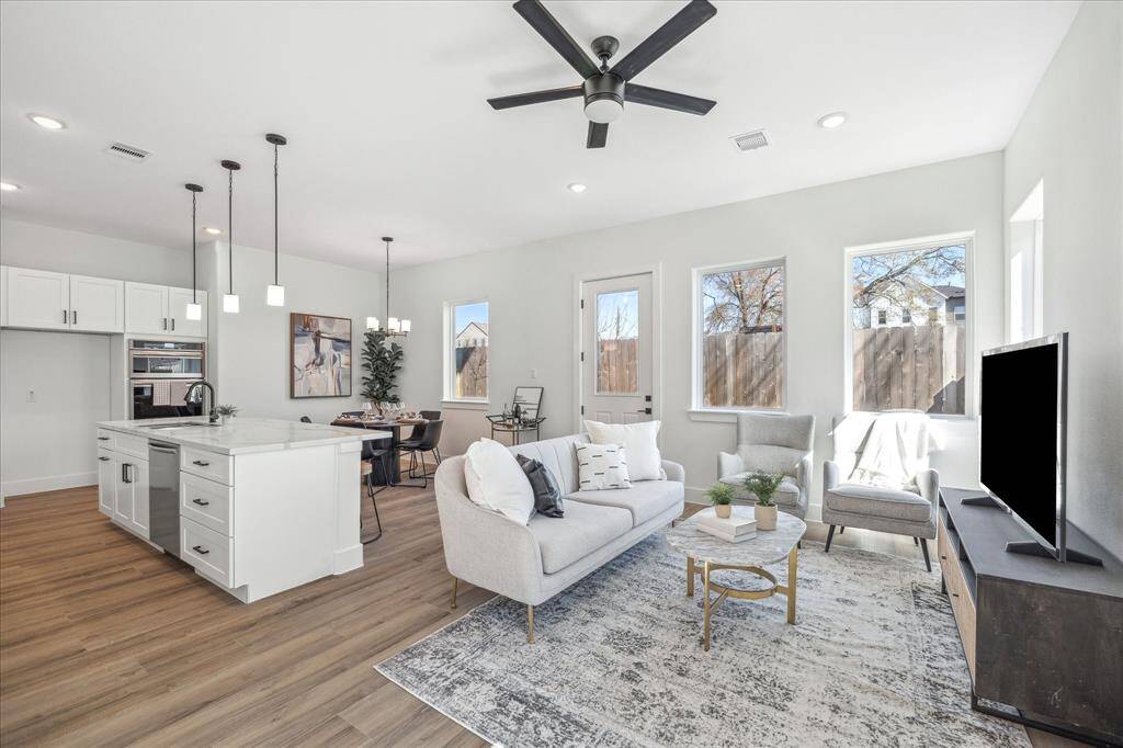 Open concept living at it's finest, with living, dining, kitchen, garage access and a half bath, all located on the first level of this home. Window treatments (not shown) have been installed as an added bonus!