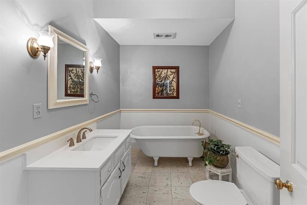 Downstairs bathroom has working bear-claw bathtub.
