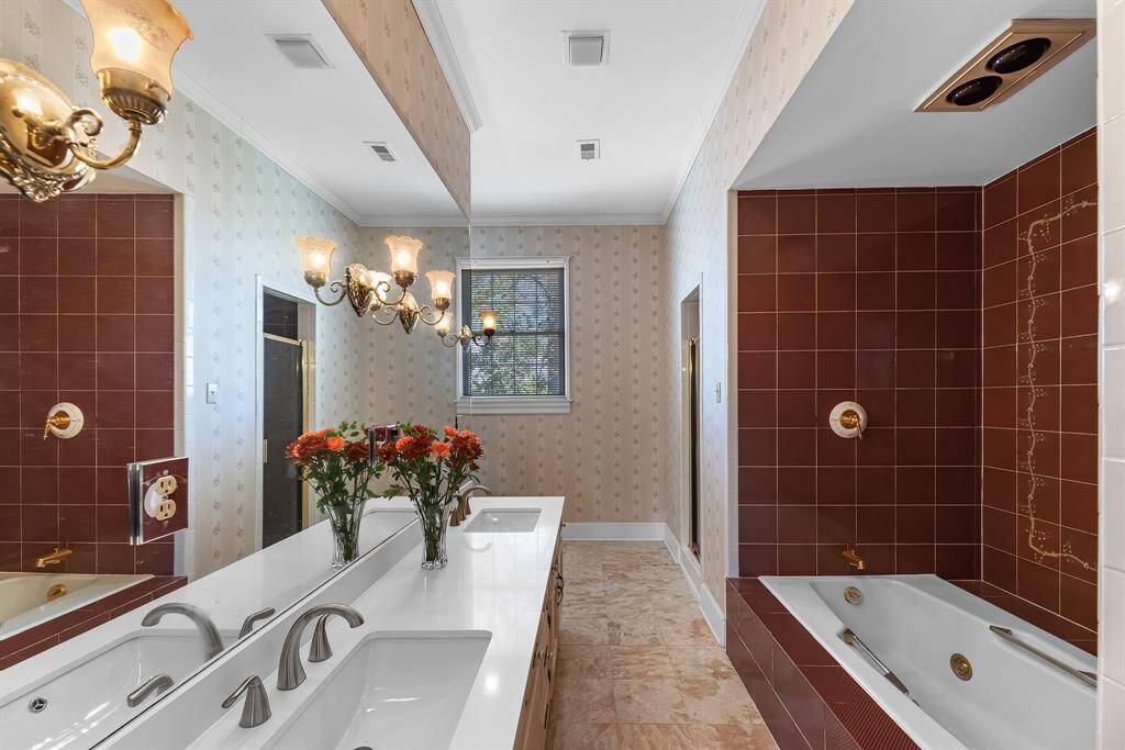 Massive primary restroom with a soaking tub and separate standing shower