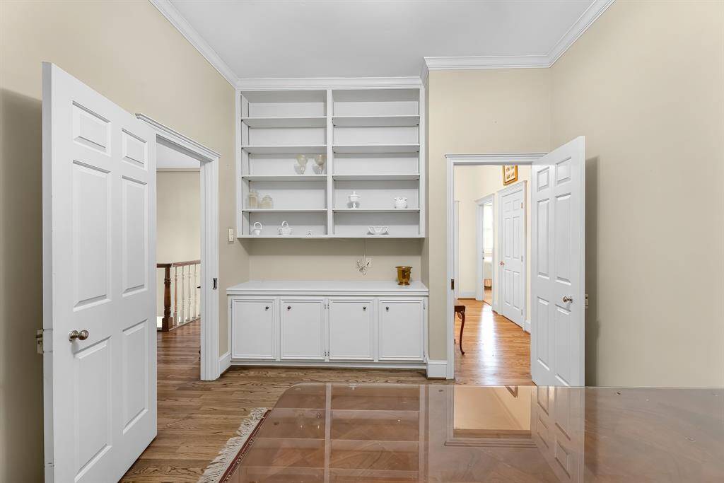 Other view of the study with built in shelving and lower cabinets