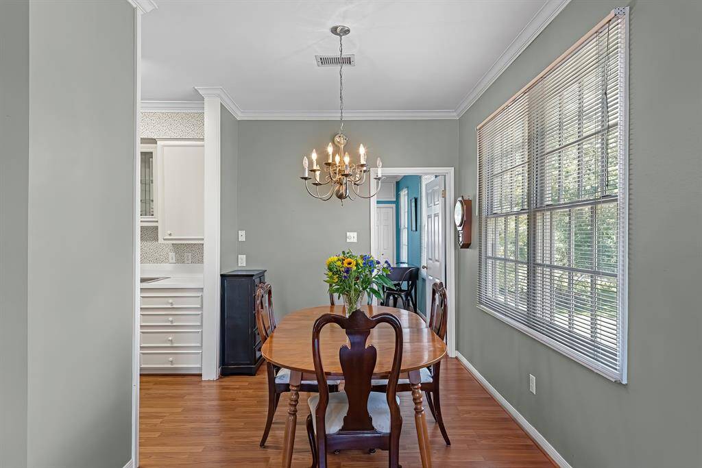 A dining area in the apartment is big enough to fit 6 around the dining table