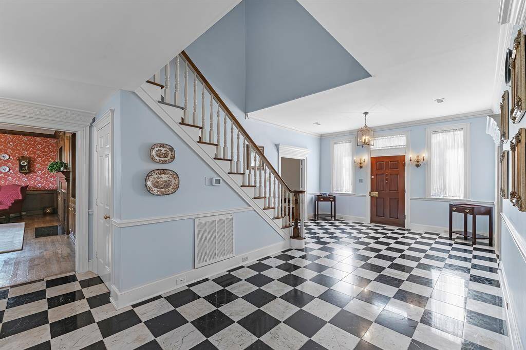 A closet under the stairwell for storage and another coat closet off to the right