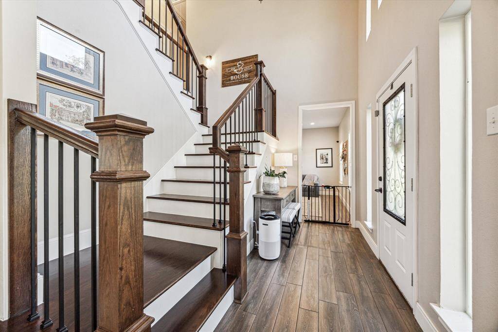 This elegant staircase, remodeled in 2019, offers a wider design than the original and includes a convenient closet underneath for extra storage.