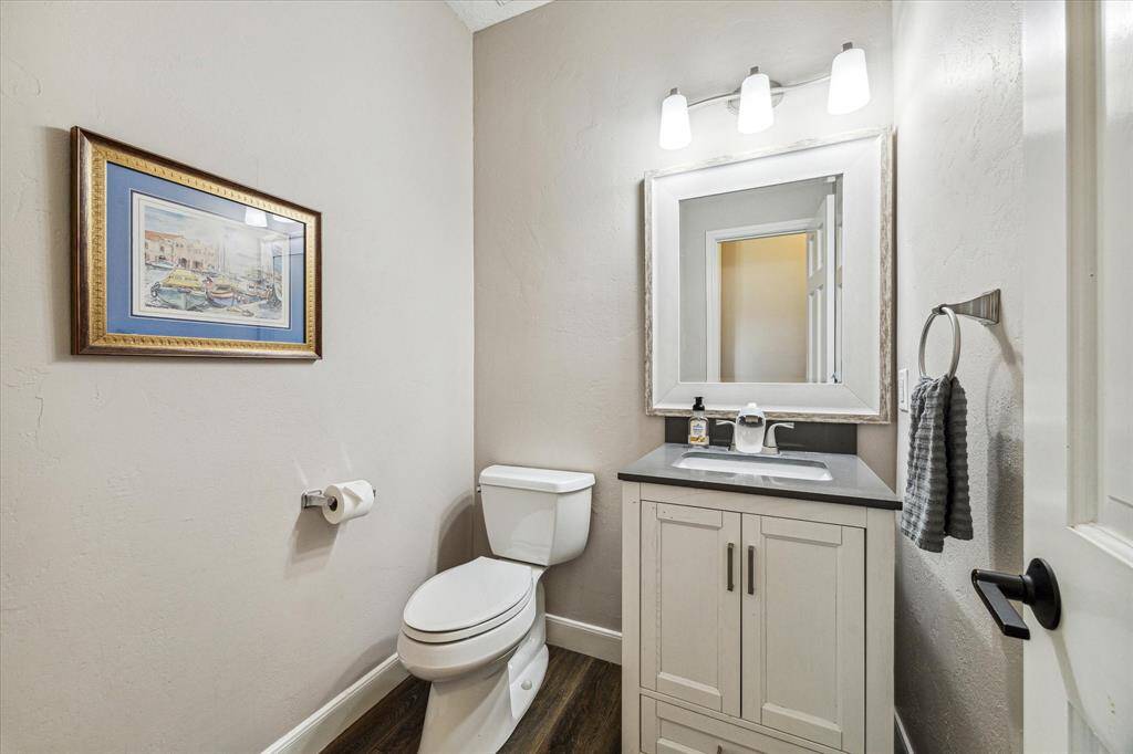 Convenient powder room located off the dining area.