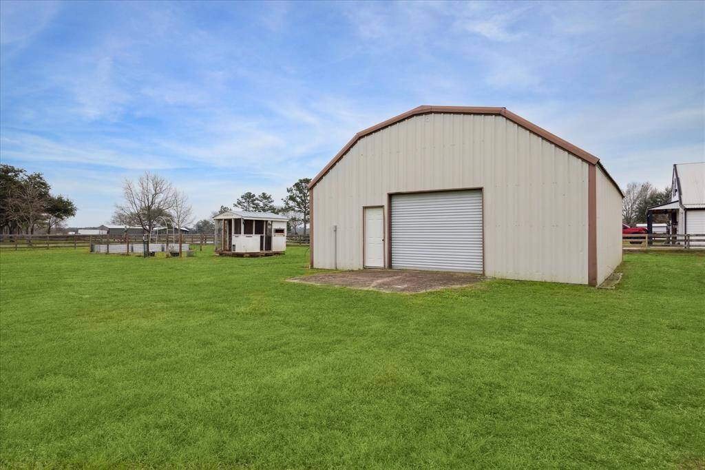 The 30' x 40' metal barn at the back of the property is fully powered, offering versatile usage options.
