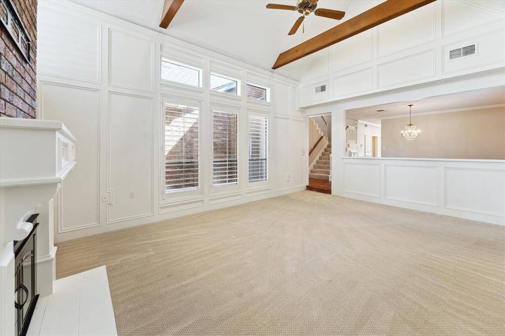 Natural light flows in through these giant windows enhancing the room and inviting you in.