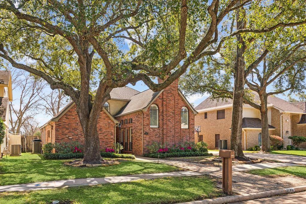 Beautiful trees welcome you to this 4 bedroom, 3 1/2 bath home complete with gracious light filled rooms, high ceilings, incredible built-ins and inviting spaces.