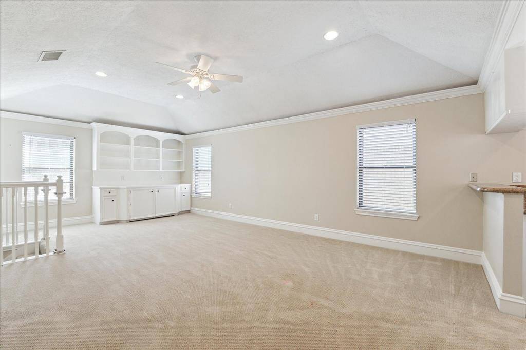 At the top of the back stairs is this marvelous gameroom/office/den/craft room/ playroom.  This is the perfect space for whatever special room fits your family.