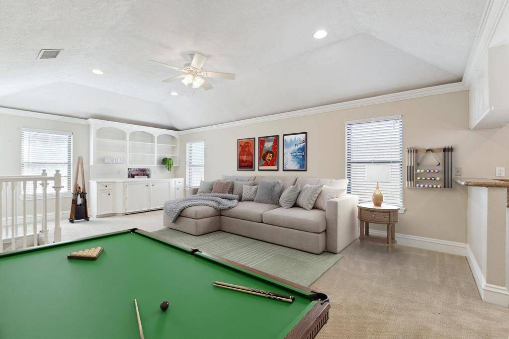 Virtual staging showing the versatility of the upstairs gameroom/den/playroom/