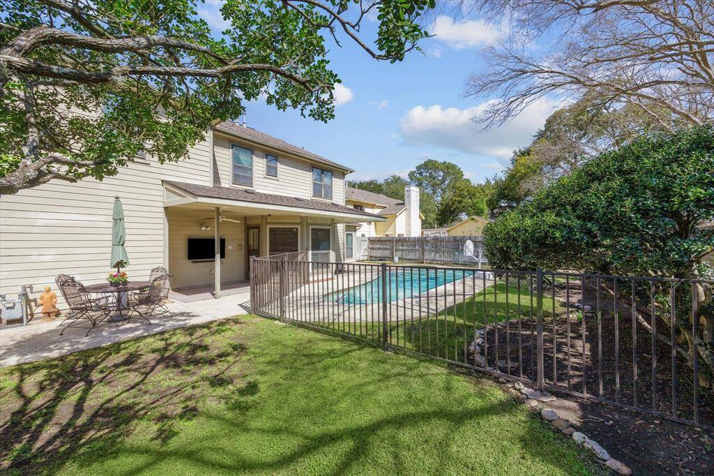 The back yard is lined with lovely flower beds and is a private sanctuary!