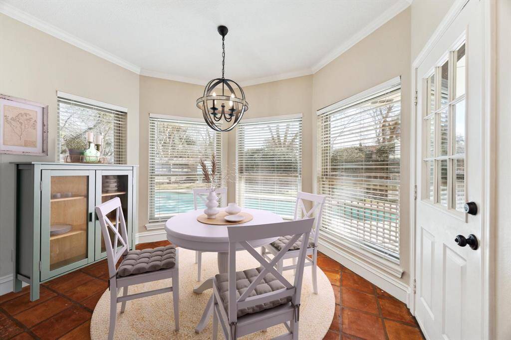 Virtual staging shows off the light filled breakfast room.