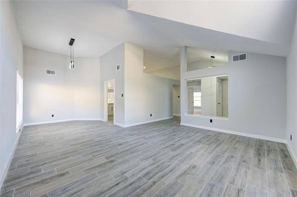 Experience seamless living with this spacious open-concept sitting and dining area, perfect for modern lifestyles.